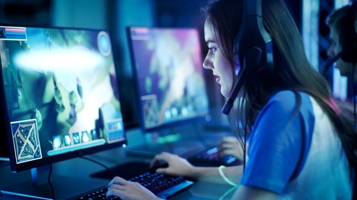 female gamer playing video game