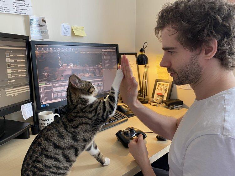 indie game developer with his cat